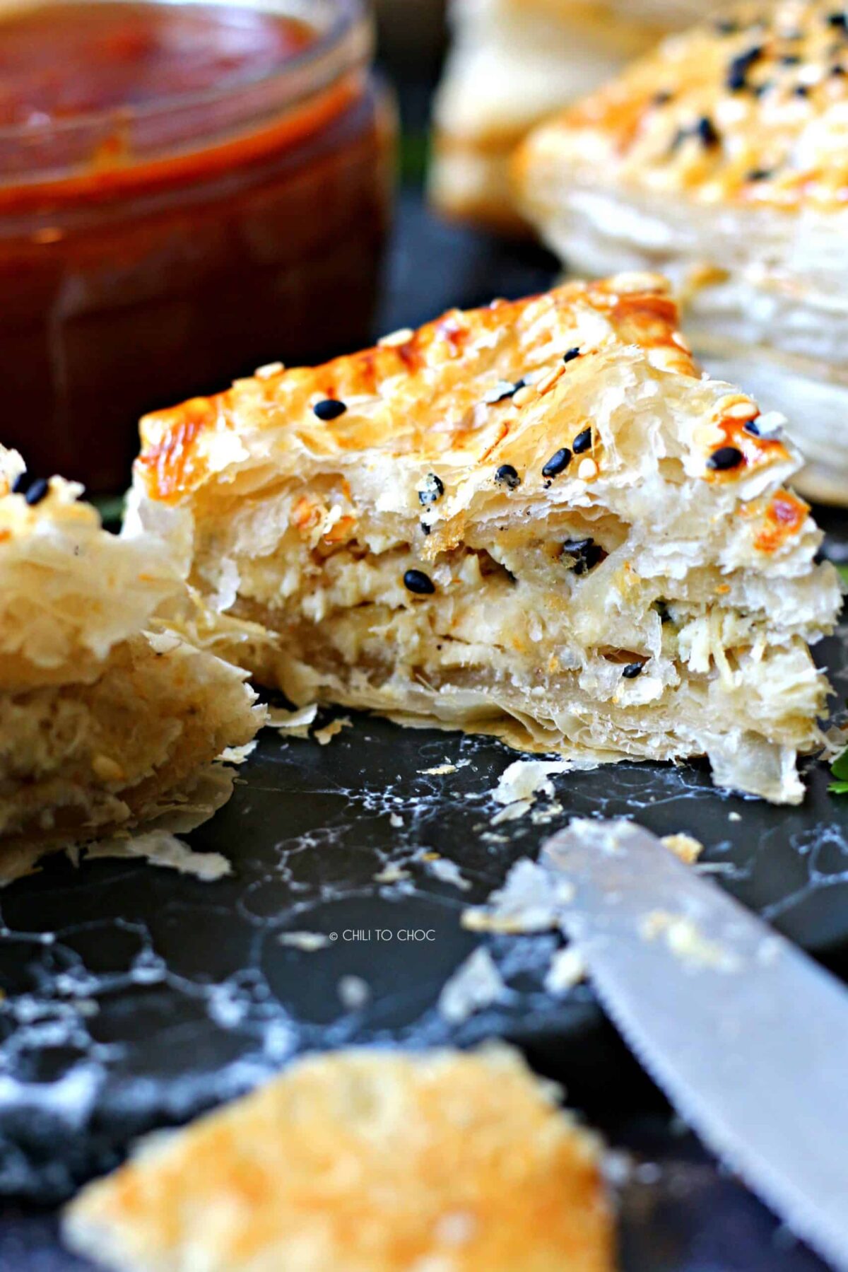 Close up of sliced up chicken in puff pastry