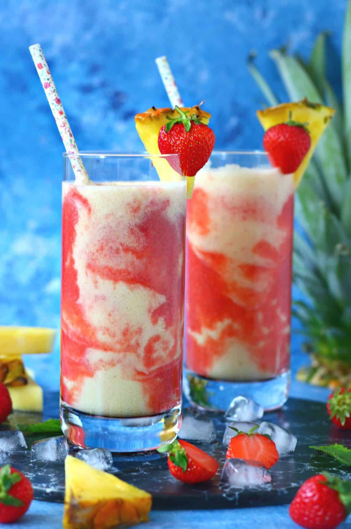 Strawberry Pina Colada with pineapple wedge and strawberry