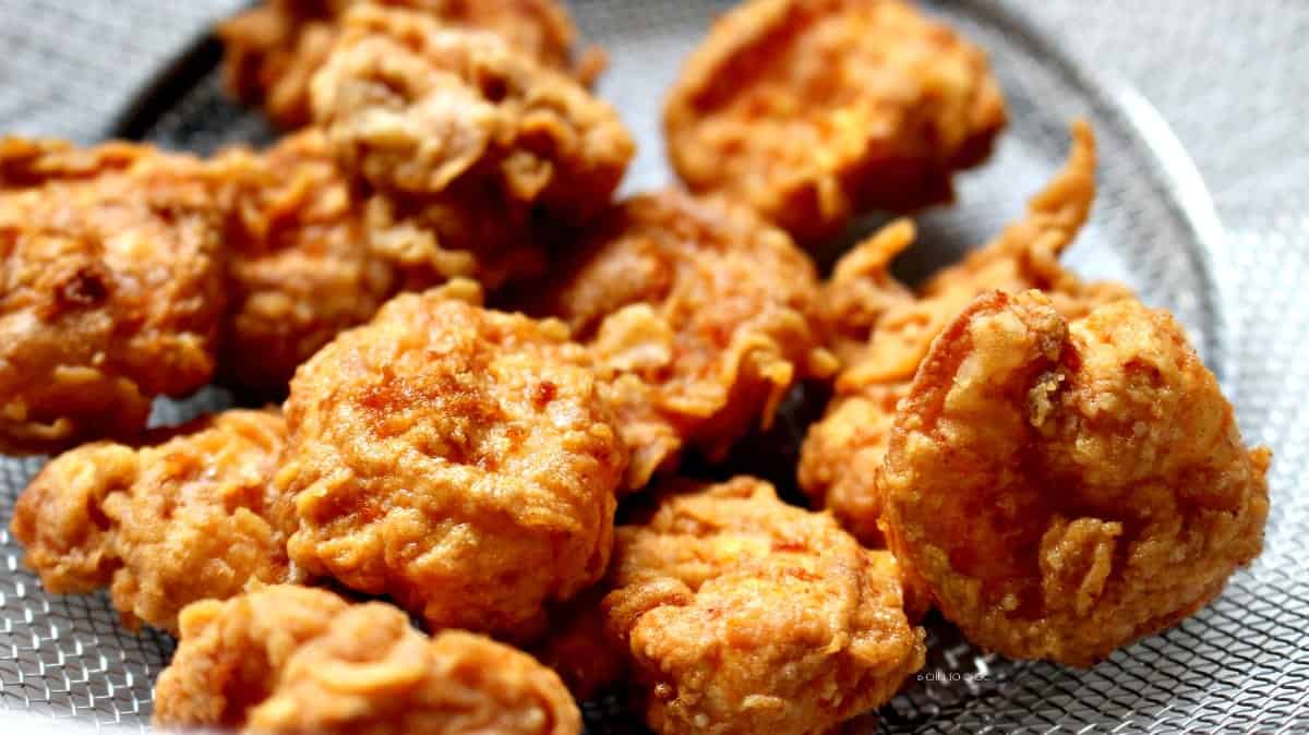 Crispy fried shrimp in a colander