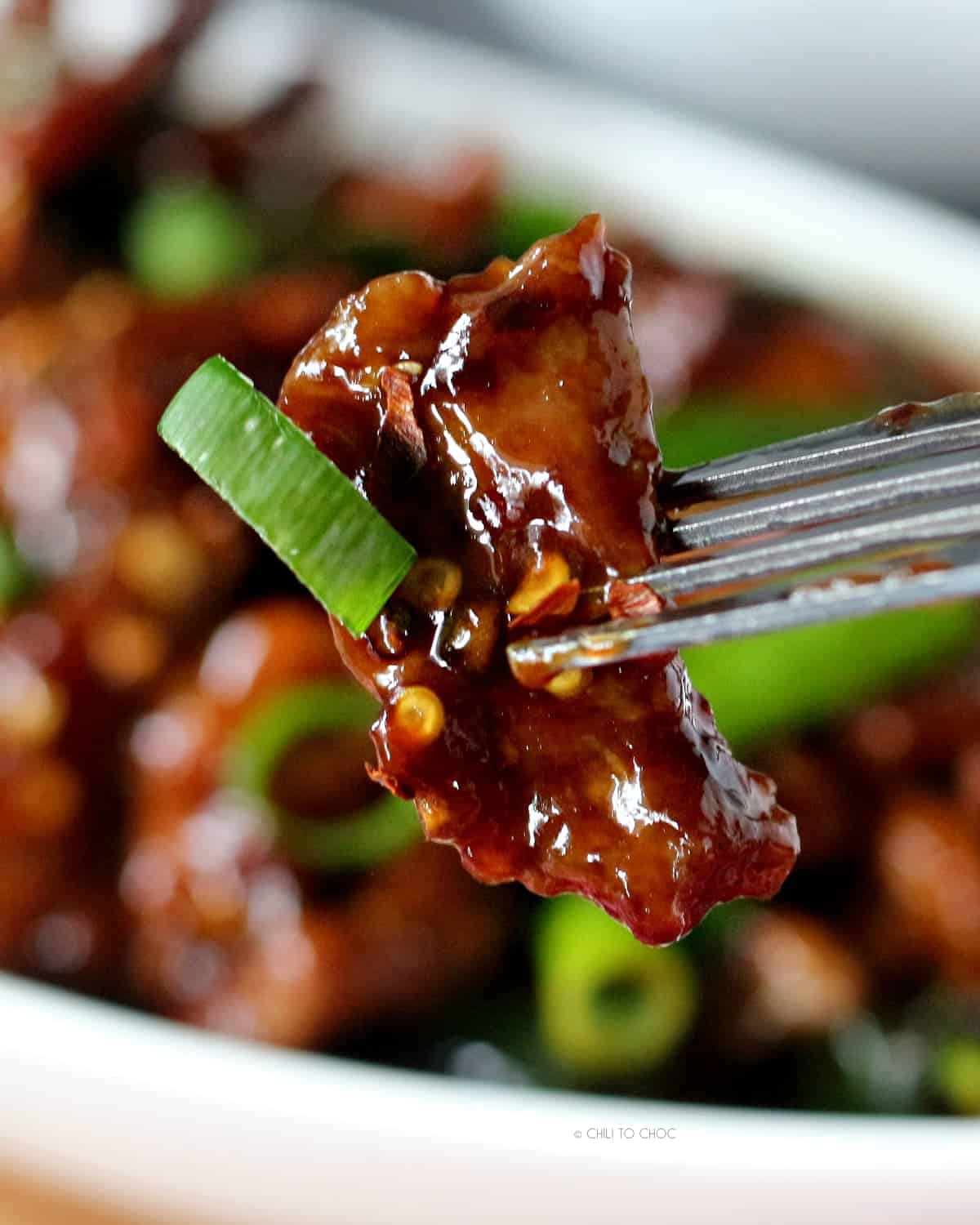 A piece of fried beef glazed with Mongolian sauce