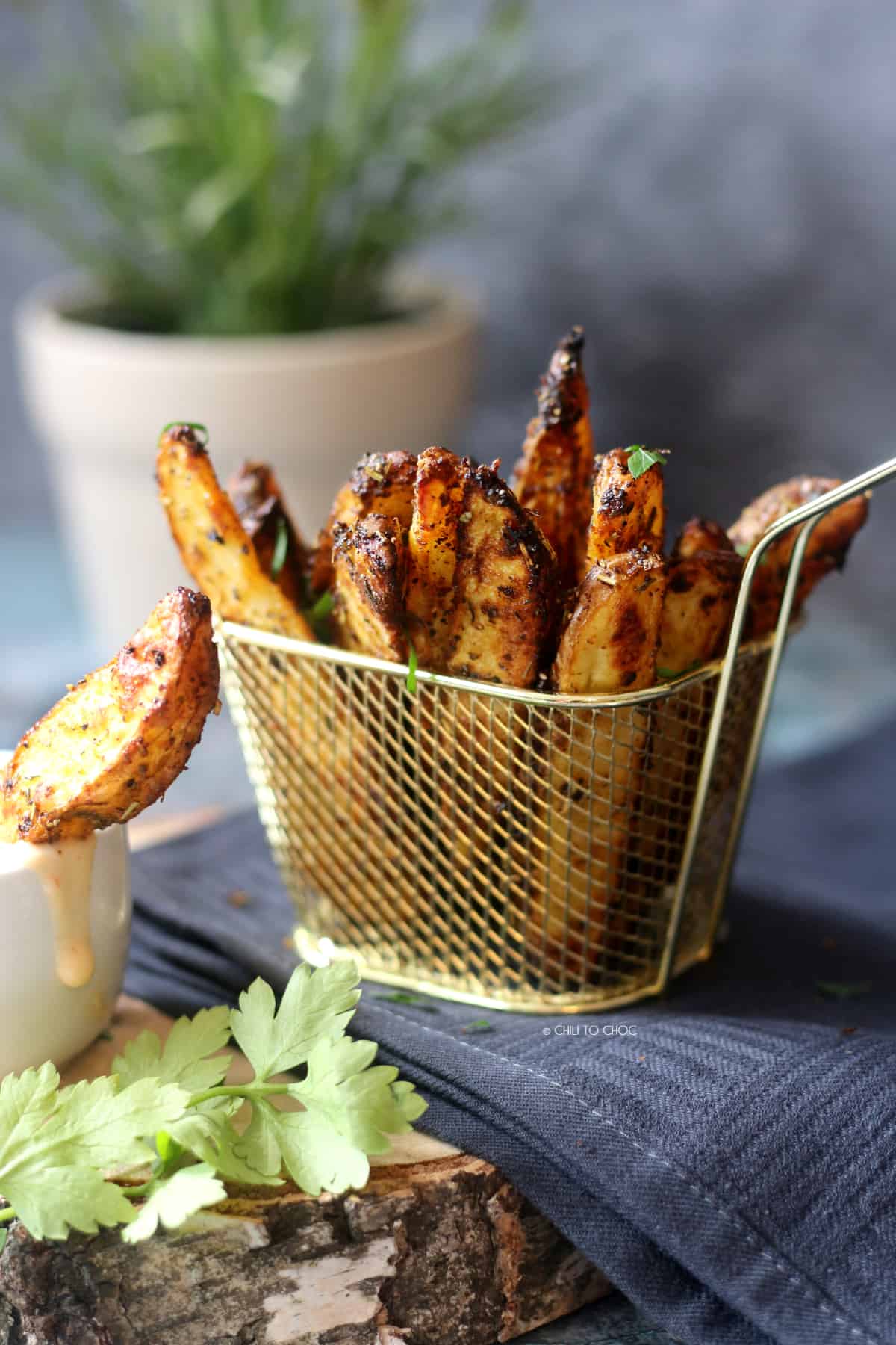 Potato Wedges in a fries basket.