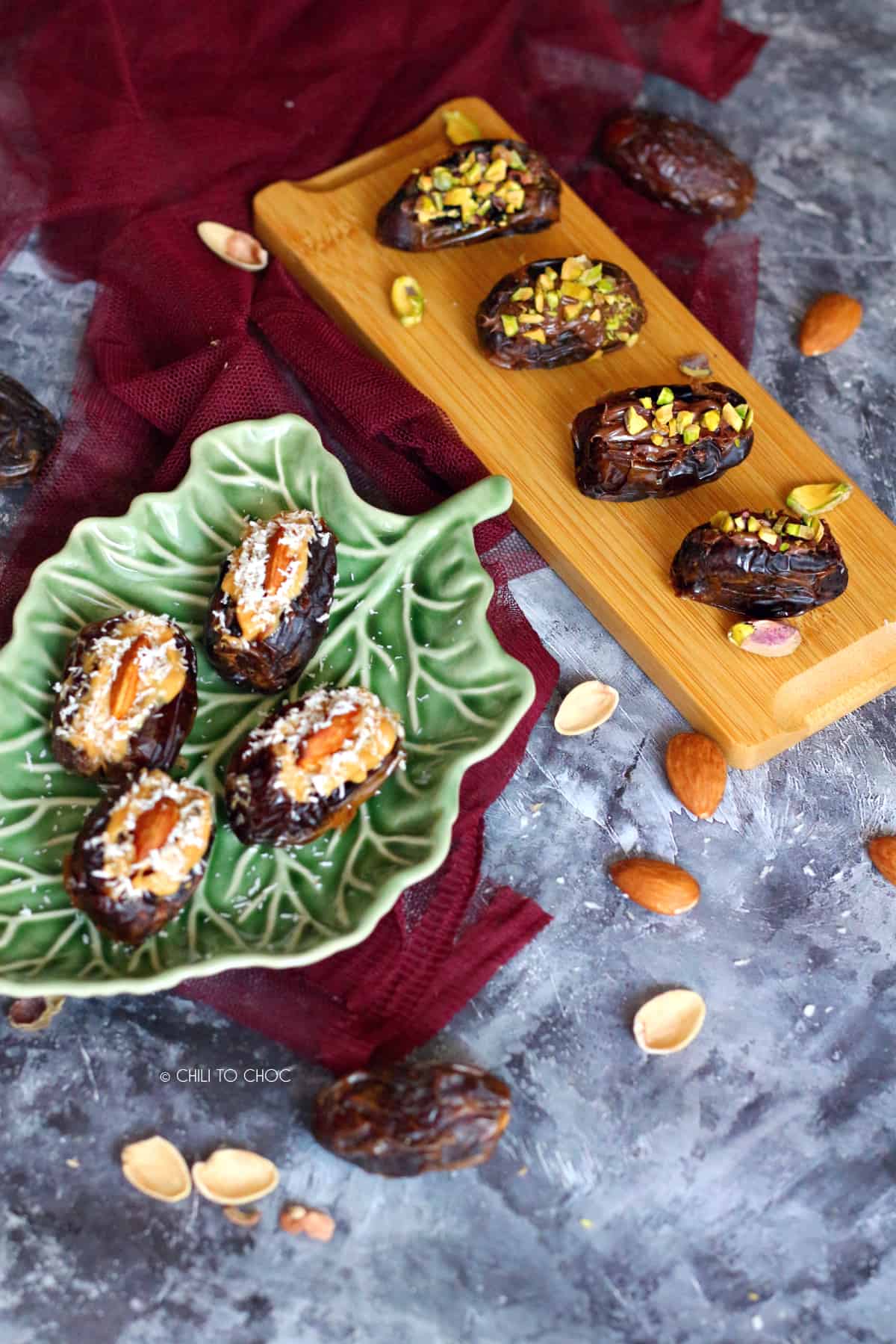 8 stuffed dates using peanut butter, nutella, pistachio and almond set on 2 different platters