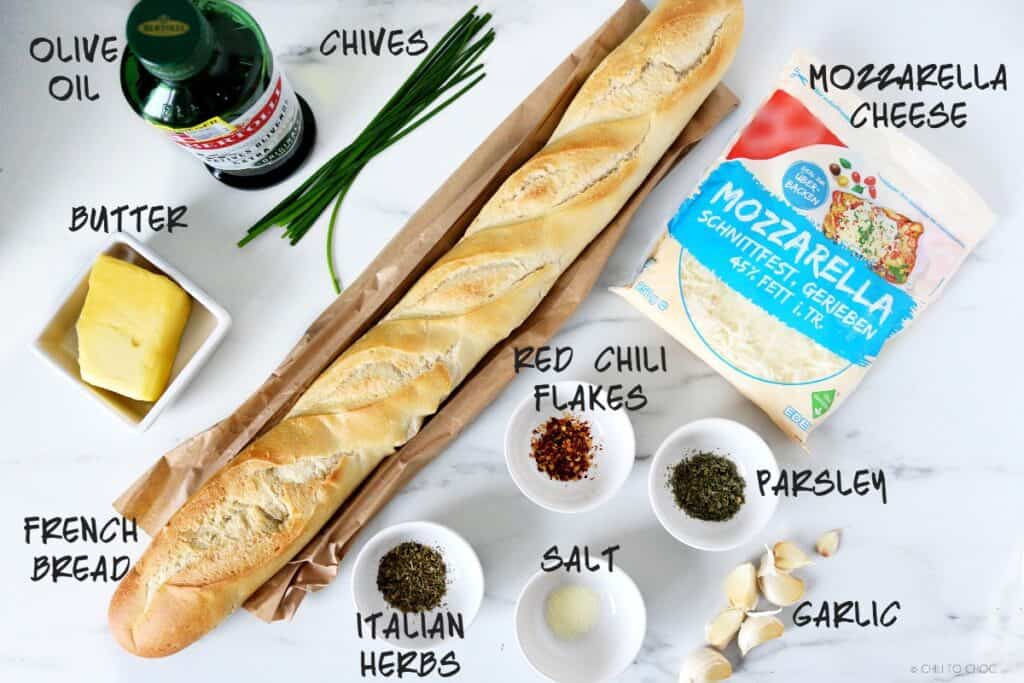 Ingredient for the garlic bread including butter, olive oil, mozzarella cheese, French bread, garlic and herbs
