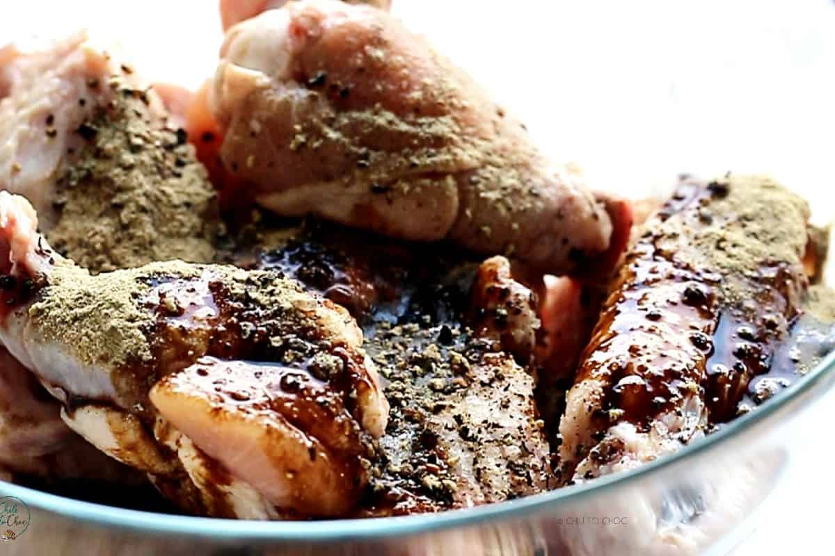 Chicken wings in a marinade.