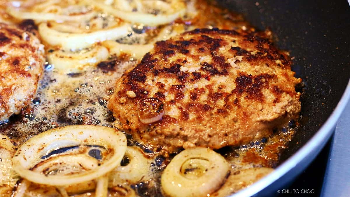 Cooking beef with sliced onions.