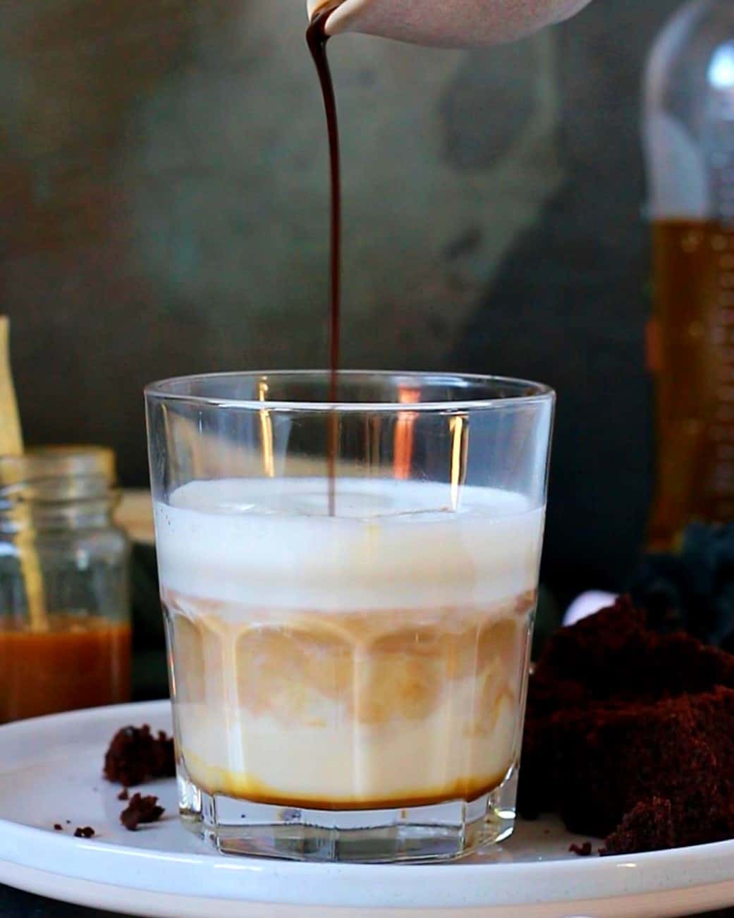 Adding espresso shot to the glass.