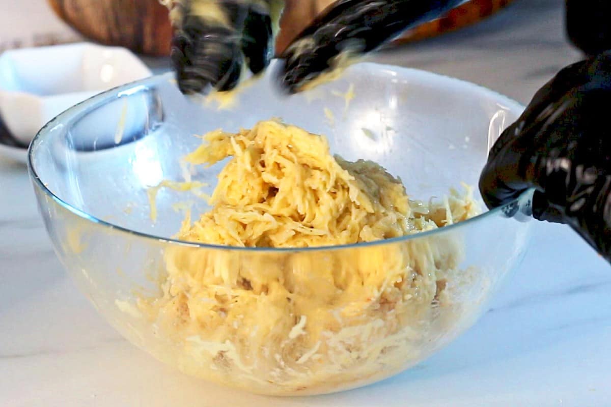Mixing potato pancake batter.