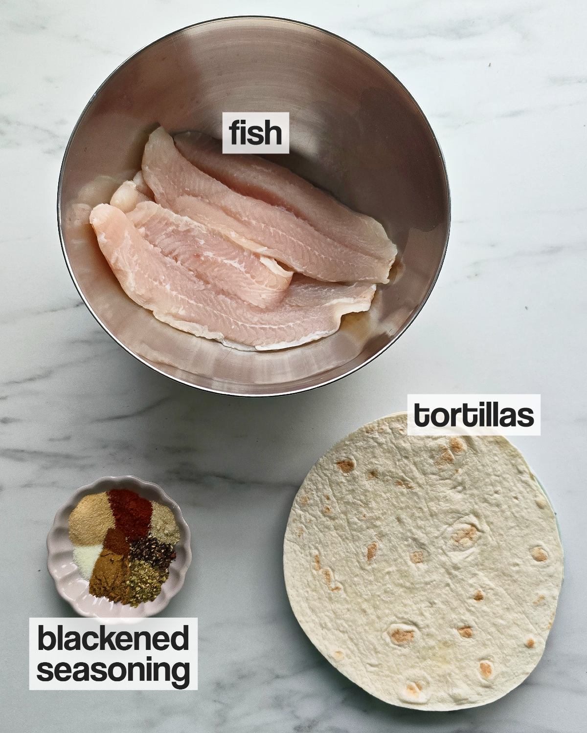 Labeled ingredients for making fish tacos.