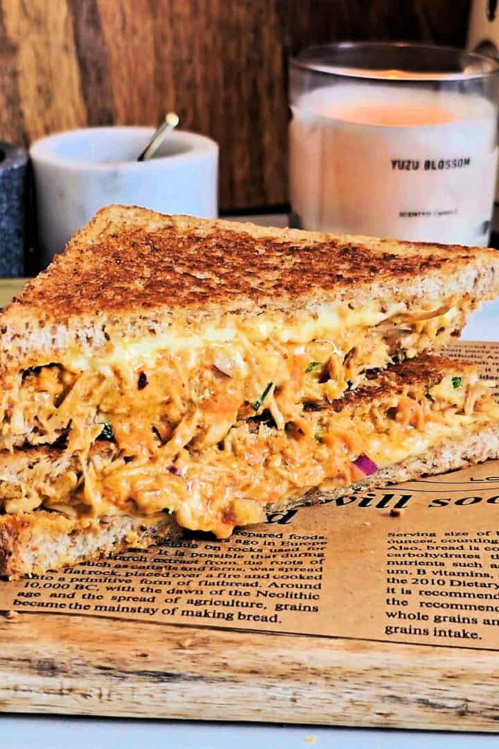 Oozing melting filling from chicken melt sandwiches.