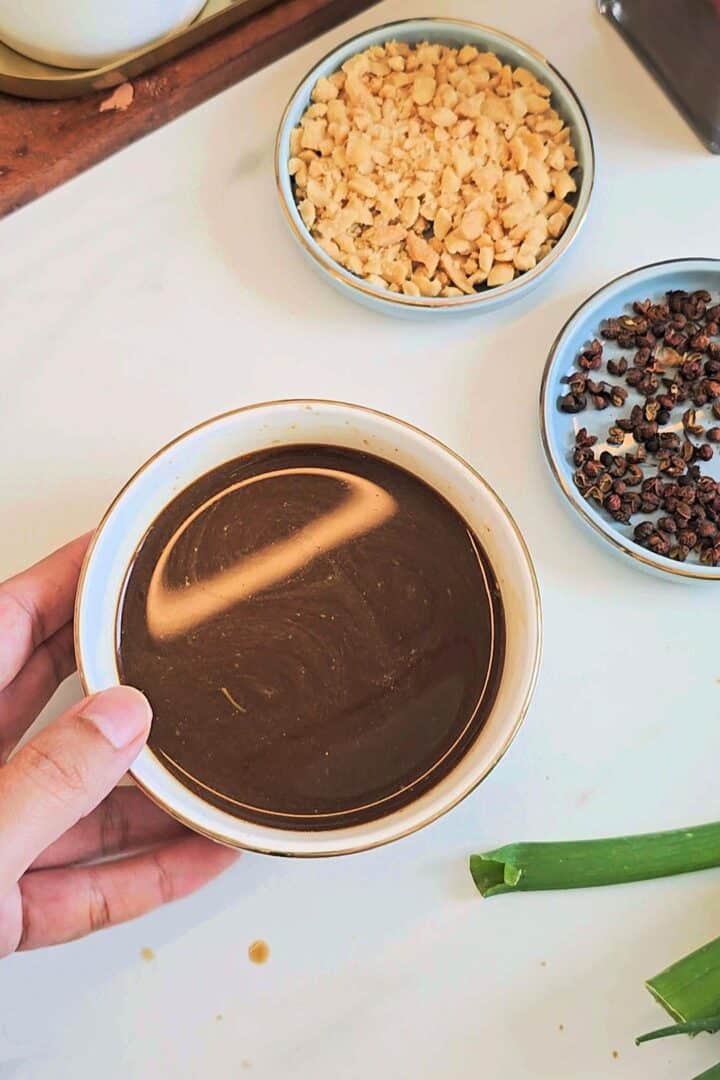 Kung pao sauce in a dip bowl.