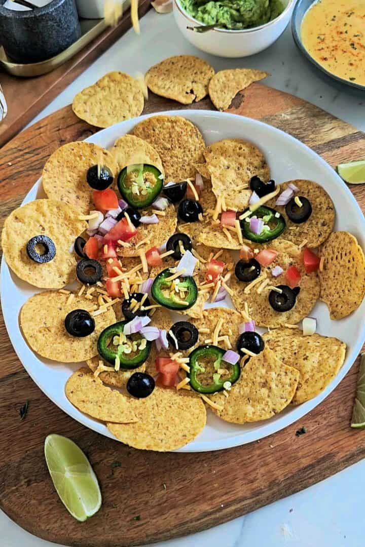 Tortilla chips topped with sliced black olives, diced tomato, red onion, and fresh jalapeรฑos.