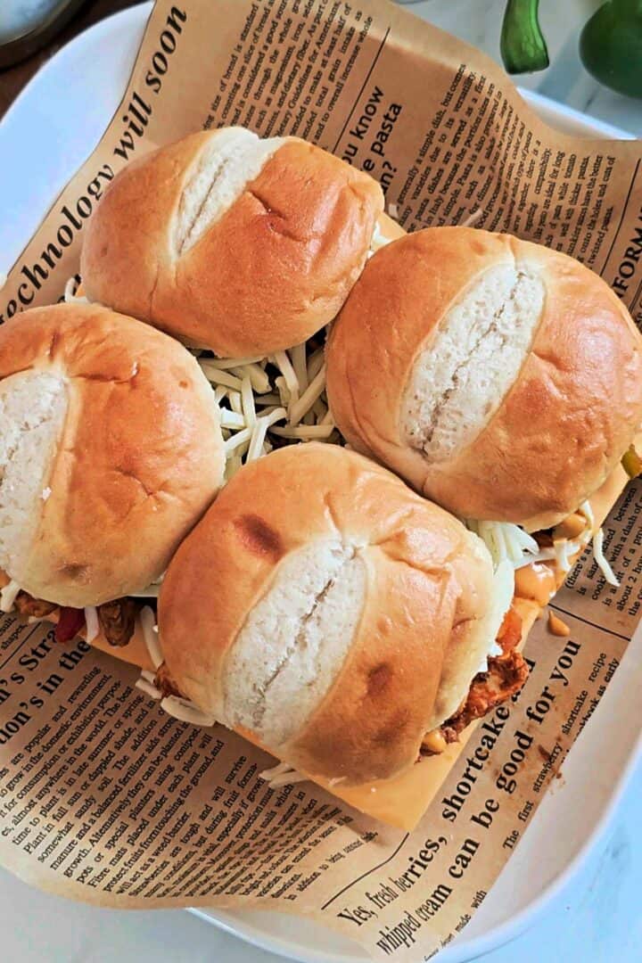 Slider buns placed on top of the filling.